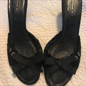 Black pair if Coach slip on pumps with bows.